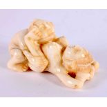 A JAPANESE CARVED BONE EROTIC OKIMONO. 5 cm x 3 cm.