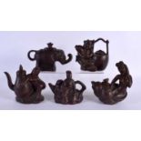 FIVE CHINESE YIXING POTTERY TEAPOT AND COVERS. Largest 15 cm wide. (5)