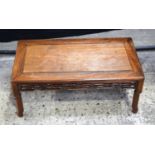 A small Chinese hardwood opium table 32 x 76 cm.