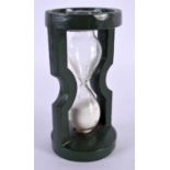 AN UNUSUAL COLD PAINTED IRON VICTOR ENGLAND SAND TIMER. 11 cm high.