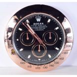 A Contemporary Rolex dealership style wall clock 34 cm.