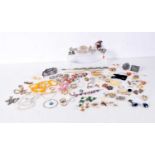 A collection of Costume jewellery necklaces, broaches , rings etc