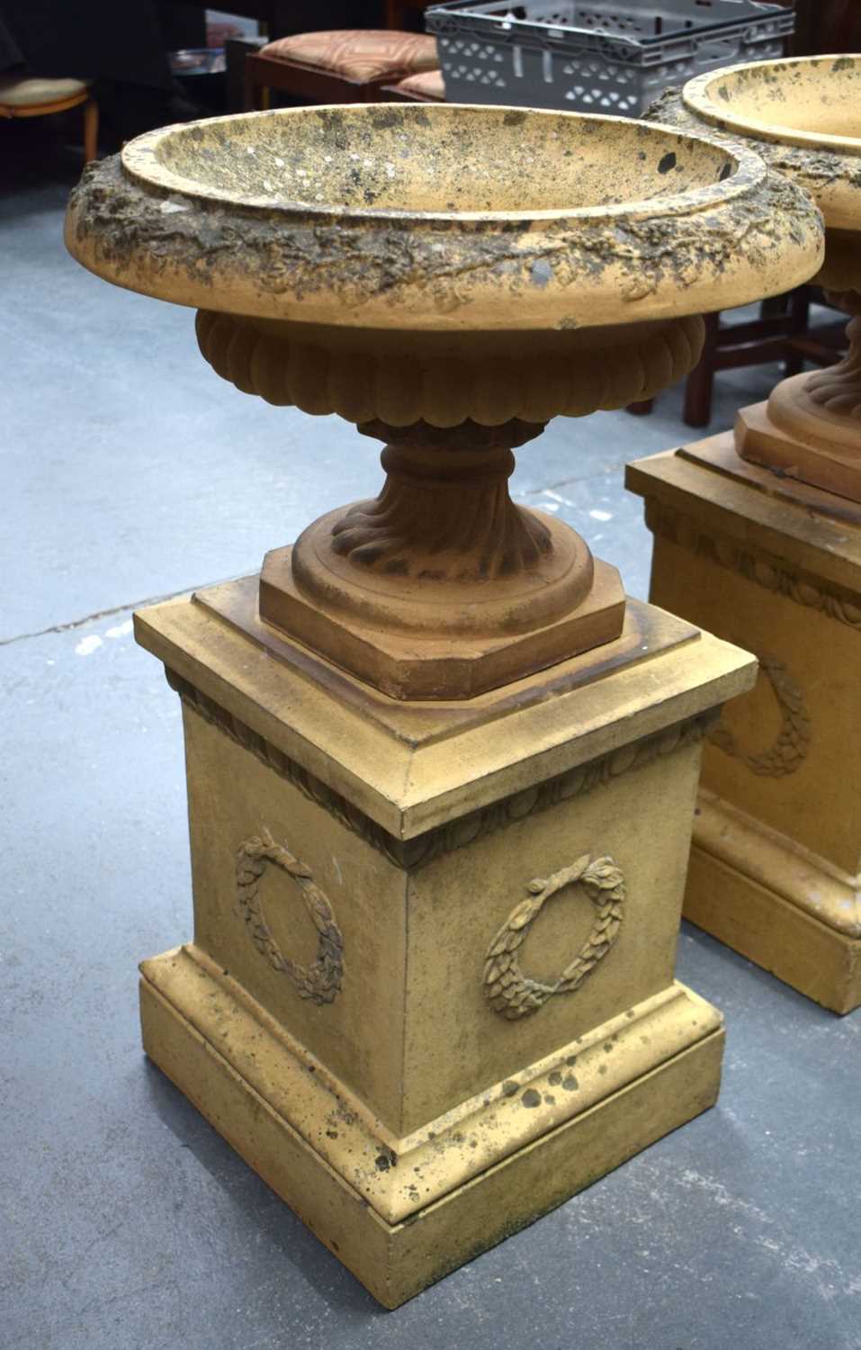 A GOOD PAIR OF 19TH CENTURY EUROPEAN TERRACOTTA URNS ON STANDS of classical form. 80 cm x 36 cm. - Image 2 of 6