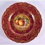 A ROYAL WORCESTER CLARET GROUND CABINET PLATE by Higgins. 20 cm diameter.