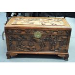 A LARGE 19TH CENTURY CHINESE CARVED HARDWOOD COFFER Qing, carved with figures in landscapes. 90 cm x