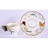 19th century English porcelain cup with butterfly handle and saucer, probably Minton, indistinct