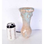 An Islamic blue glazed pottery vase. 23 cm.