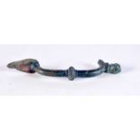 AN EARLY MIDDLE EASTERN BRONZE HANDLE. 19 cm x 5.5 cm.
