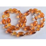 AN AMBER NECKLACE. 47 grams. 57 cm long.