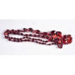 A CHERRY AMBER TYPE NECKLACE. 61 grams. 96 cm long.