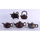 FIVE CHINESE YIXING POTTERY TEAPOT AND COVERS. Largest 15 cm wide. (5)