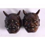 TWO JAPANESE CARVED BOXWOOD MASK NETSUKES. 5 cm x 3.75 cm. (2)