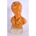 AN EARLY 20TH CENTURY EUROPEAN WAX BUST OF A YOUNG BOY upon a marble base. 20 cm high.