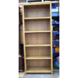 A large oak shelving unit 215 x 86 x 40 cm.