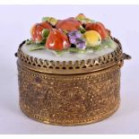 A CONTINENTAL PORCELAIN GILT METAL FRUIT PILL BOX. 7 cm wide.