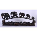 A LATE 19TH CENTURY ANGLO INDIAN CARVED HARDWOOD ELEPHANT GROUP modelled roaming. 45 cm x 20 cm.