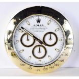 A Contemporary Rolex dealership style wall clock 34 cm.