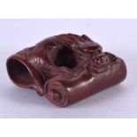 A JAPANESE CARVED BOXWOOD DRAGON NETSUKE. 4 cm x 3 cm.