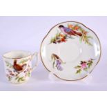 Royal Worcester coffee cup and saucer of lobed square shape painted with naturalistic birds by