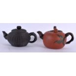 TWO CHINESE YIXING ZISHA POTTERY TEAPOTS AND COVERS 20th Century. 10 cm wide. (2)