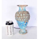 An Islamic blue glazed pottery vase. 23 cm.