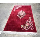 A Chinese rug 237 x 123 cm.