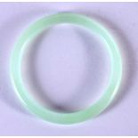 A CHINESE CARVED ICEY JADEITE BANGLE 20th Century. 7.5 cm diameter.