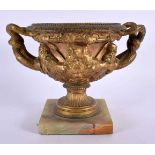 A 19TH CENTURY EUROPEAN GRAND TOUR GILT BRONZE WARWICK VASE decorated with mask heads. 18 cm x 15