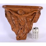 A LOVELY ART DECO CARVED WOOD WALL BRACKET formed as a stylised female holding aloft a draped dress.