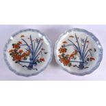A PAIR OF 19TH CENTURY JAPANESE MEIJI PERIOD IMARI DISHES painted with flowers. 21 cm wide.