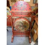 A LARGE 19TH CENTURY CHINESE RED LACQUERED DRAGON GONG with two beaters. 144 cm x 107 cm.