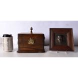 An Antique wooden box with brass Lion head handles together with a framed bronze head of Shakespeare