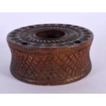 AN ANTIQUE CONTINENTAL TREEN FRUITWOOD INCENSE BURNER decorated with roundels. 9.5 cm diameter.