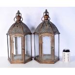 A pair of Islamic style openwork copper and glass lanterns 49 cm (2).