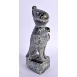 AN EGYPTIAN REVIVAL CARVED STONE FIGURE OF HORUS. 21 cm high.