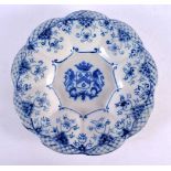 AN 18TH CENTURY DELFT BLUE AND WHITE ARMORIAL LOBED MELON DISH painted with an armorial. 25 cm