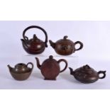 FIVE CHINESE YIXING POTTERY TEAPOT AND COVERS. Largest 15 cm wide. (5)