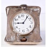 AN ANTIQUE SILVER CASED TRAVELLING CLOCK. 247 grams. 8.25 cm x 7.5 cm.