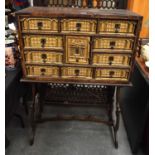 AN UNUSUAL 17TH CENTURY CONTINENTAL CARVED GILTWOOD TABLE CABINET upon a later stand, carved with