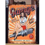 A contemporary metal advertising sign for a garage. 70 x 50cm.