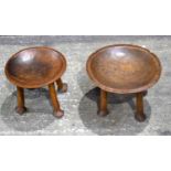 Two carved tribal wooden stools26 x 37 cm.(2).