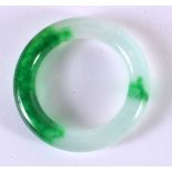 A CHINESE CARVED JADEITE BANGLE 20th Century. 8 cm diameter.