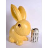 A RARE EARLY 20TH CENTURY ENGLISH YELLOW GLAZED BLUNT NOSED BUNNY. 32 cm high.