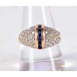 AN 18CT GOLD DIAMOND AND SAPPHIRE RING. 5.7 grams. P.