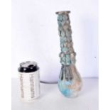 An Islamic blue glazed pottery vase. 30 cm.