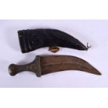 AN ANTIQUE OMANI CARVED RHINOCEROS HORN KNIFE. 33 cm x 8 cm.