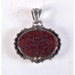 AN ANTIQUE MIDDLE EASTERN SILVER AND AGATE PENDANT. 18.7 grams. 4 cm x 3.5 cm.