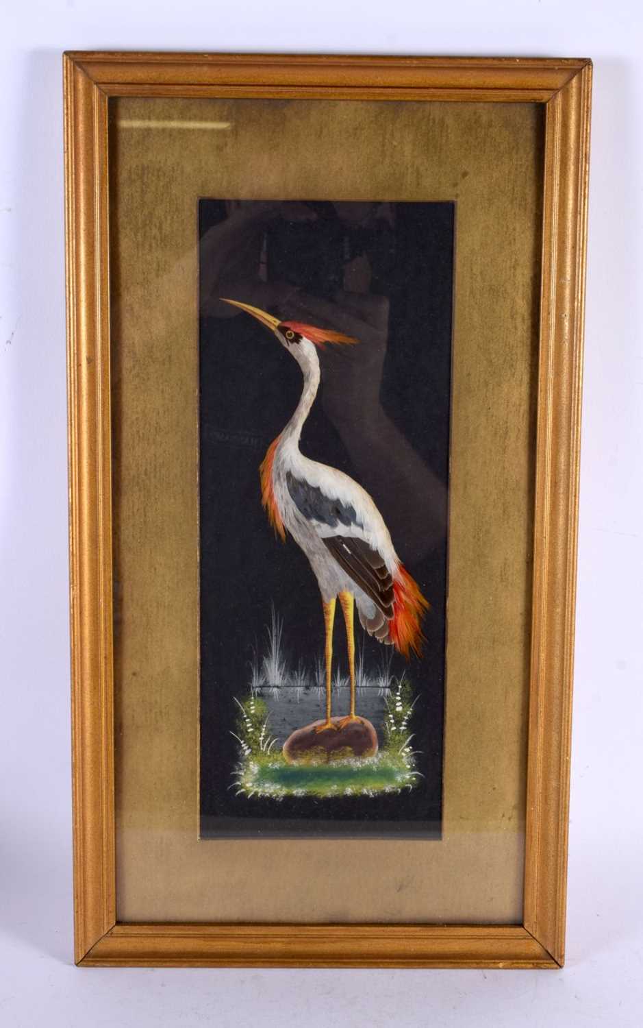 AN UNUSUAL ANTIQUE CONTINENTAL FEATHER WORK GOUACHE PAINTING depicting a stork within a landscape.