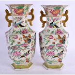 A PAIR OF 19TH CENTURY CHINESE CANTON FAMILLE ROSE VASES painted with birds. 23 cm x 8 cm.