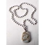 A Chinese agate necklace. 60cm.